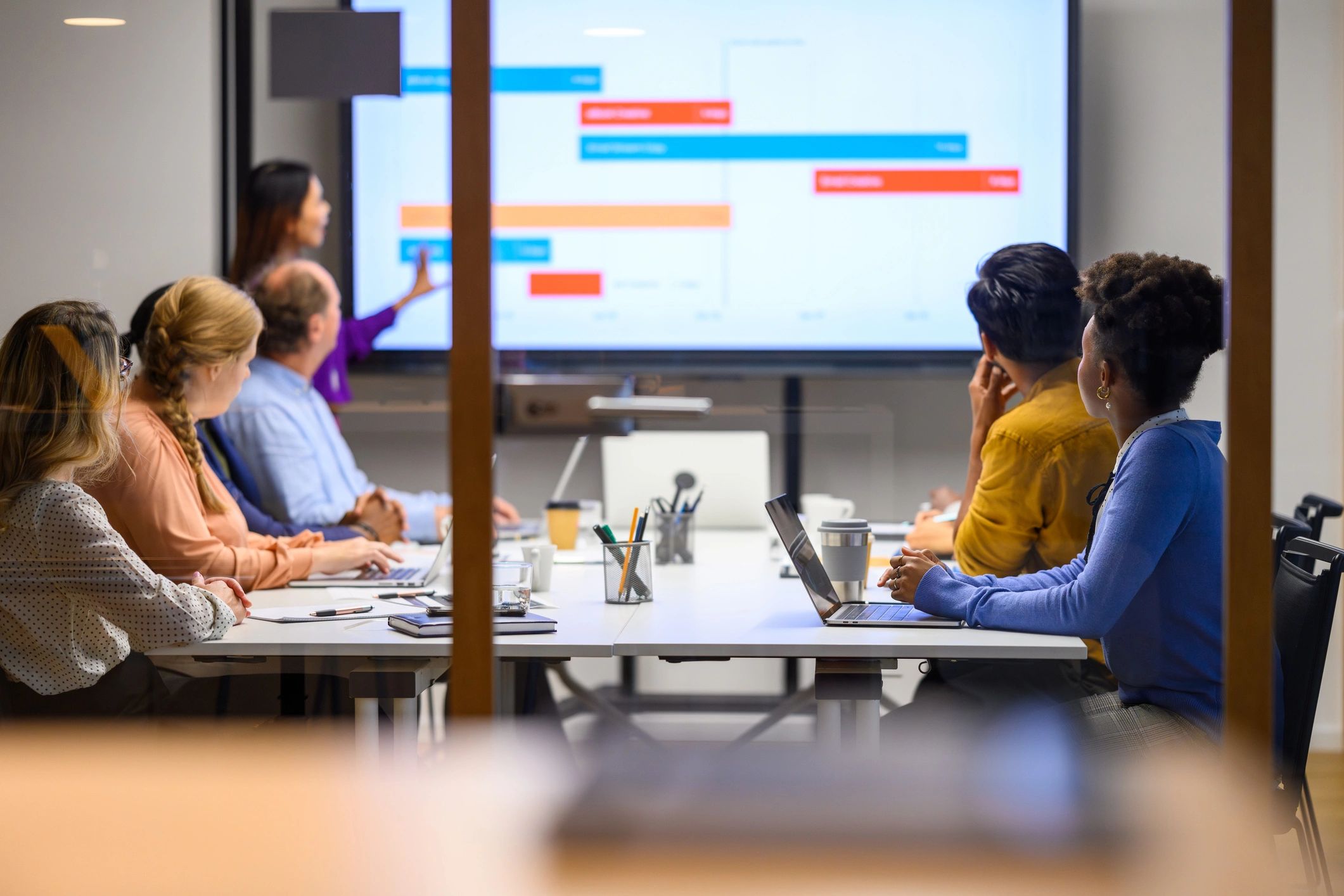 Professional IT consulting presentation in a board room